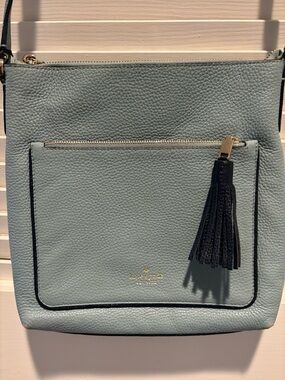kate spade women’s Pebbled Leather Crossbody in baby blue with Navy Tassel